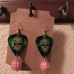 GREEN SUGAR SKULLS METAL CHARMS ON GREEN GUITAR PICK EARRINGS